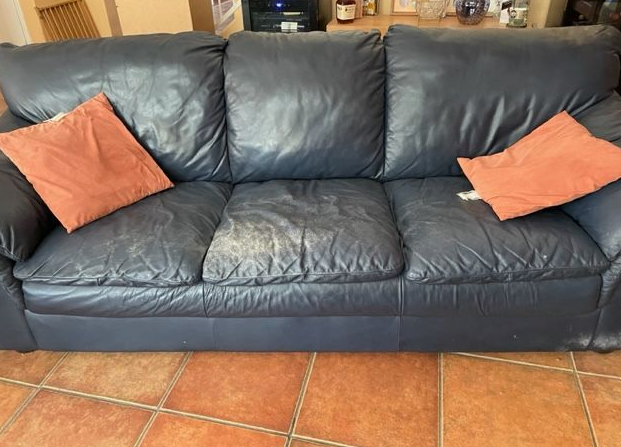 Worn blue leather sofa before leather restoration in Tucson